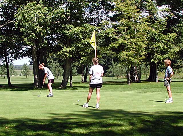 Putting on Hole 2 at MAPLE RIDGE GOLF COURSE - Click for
 next photo
